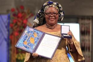 Image source: REUTERS/Cornelius Poppe/Scanpix Pictured: obel Peace Prize winner, Liberian peace activist Leymah Gbowee, poses with her award at the award ceremony in Oslo, December 10, 2011.